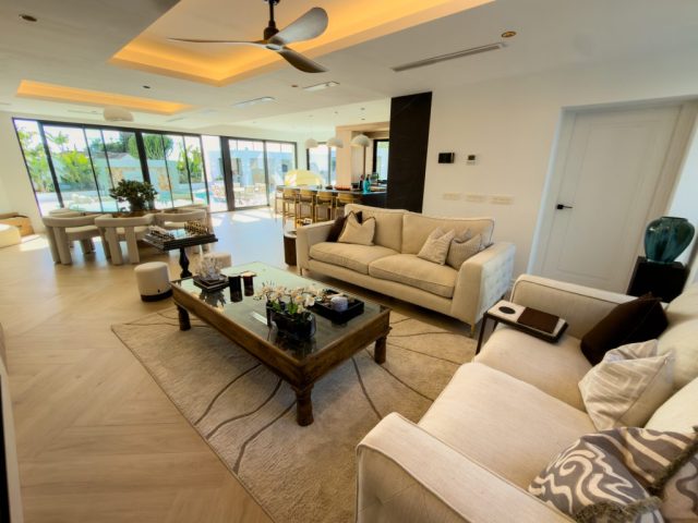 Reception room with oak flooring and recessed lighting