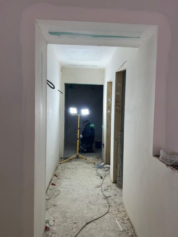 Boutique hotel guest corridor during construction