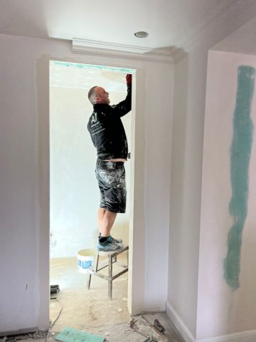 A7 craftsperson completing decorative finishes in the boutique hotel
