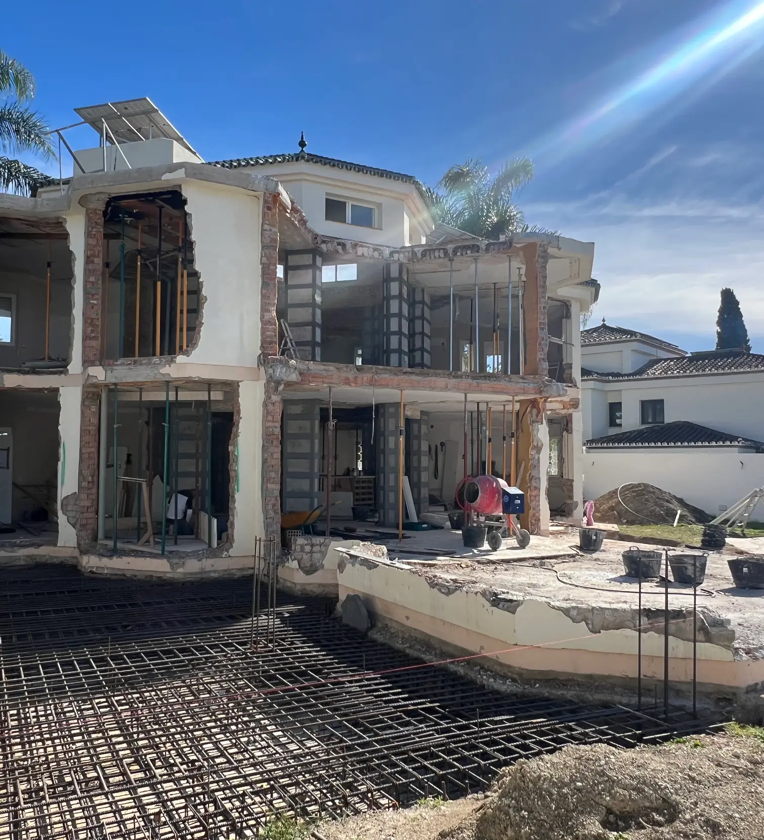 Full villa strip-out with exposed structure and rebar