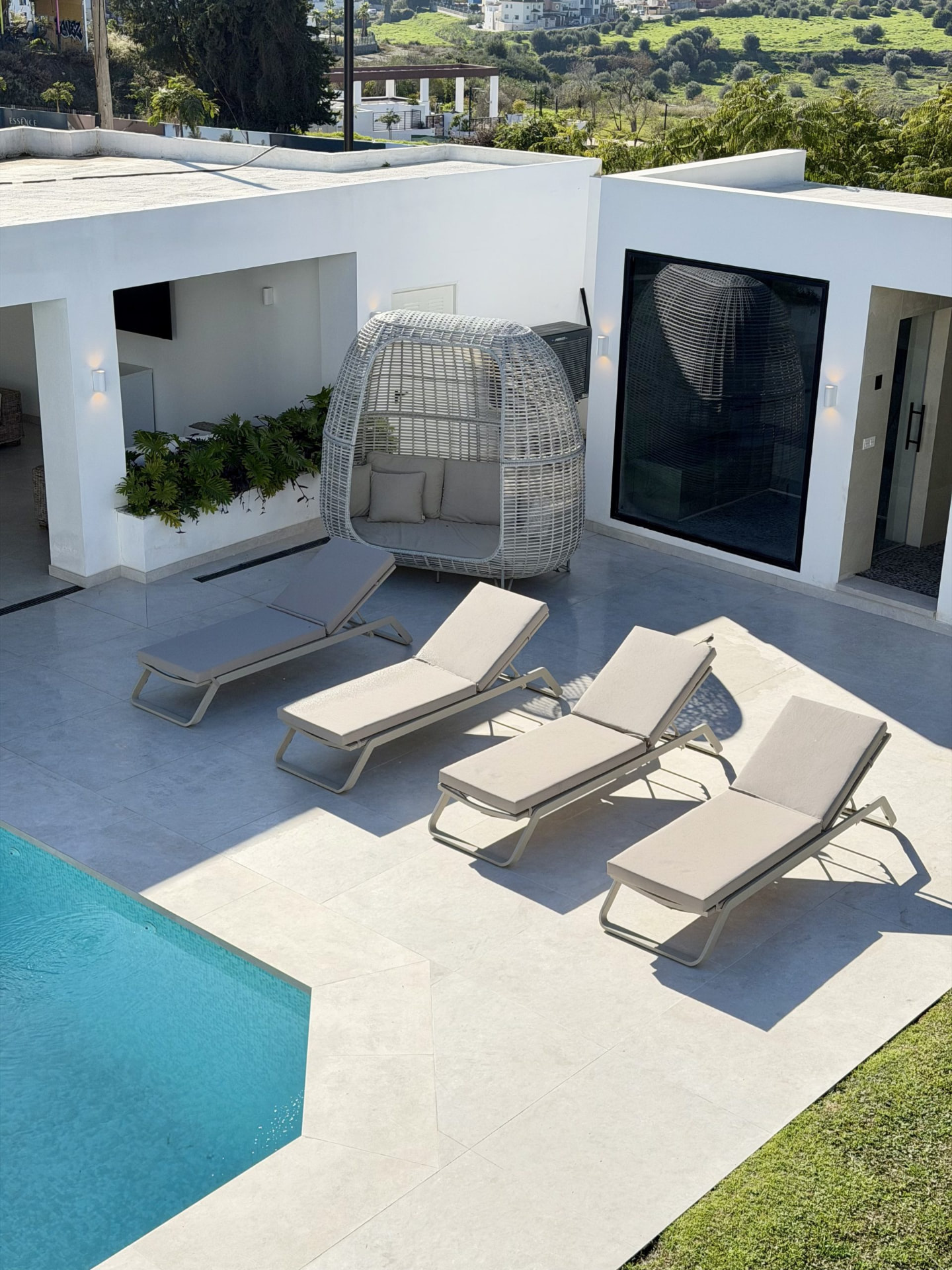 Terrace with loungers beside the pool