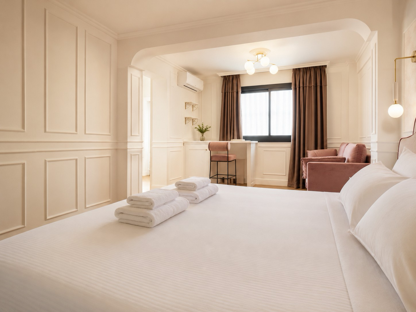 Finished boutique hotel guest suite with decorative wall panelling