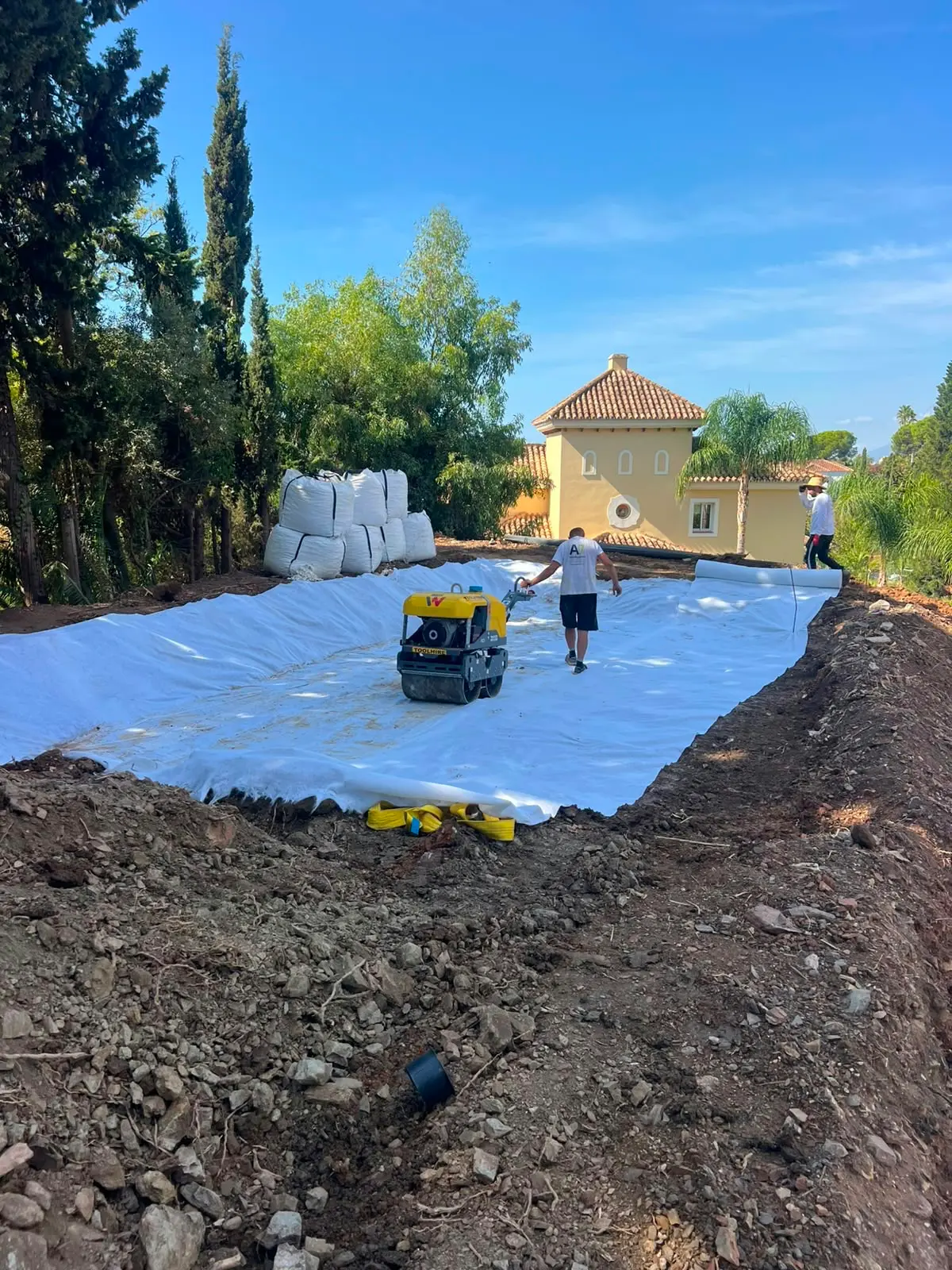 Groundworks in progress at the El Rosario site — geotextile membrane and compaction of the building platform